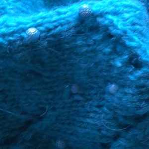 Pullover Schapulero mit Loch- und Zopfmuster