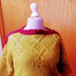 Pullover Schapulero mit Loch- und Zopfmuster